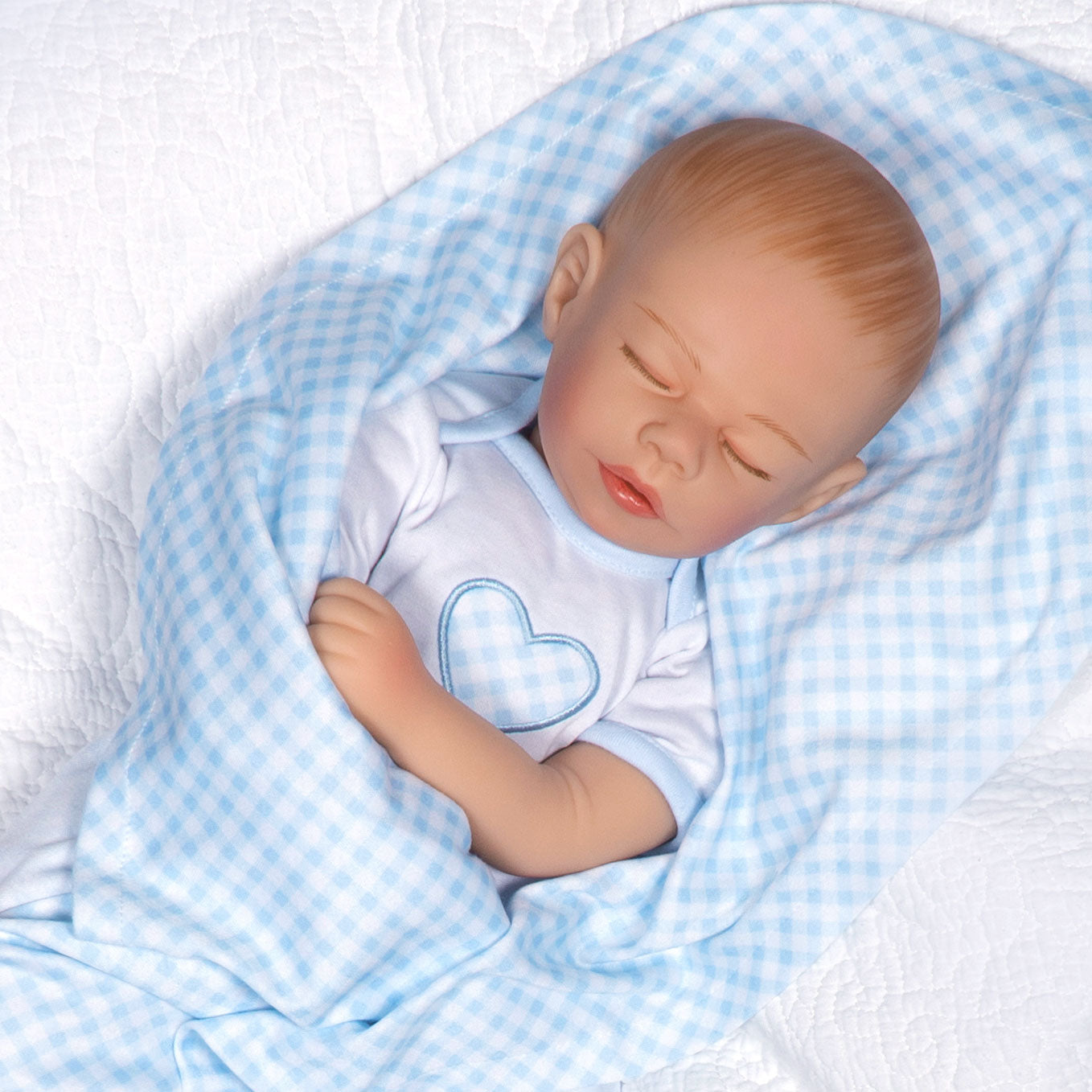 Swaddler Baby Checked Out - 18" Realistic Boy Doll by Reborn Artist, Michelle Fagan. Made in our exclusive SoftTouch Vinyl for an ultra-realistic feel!