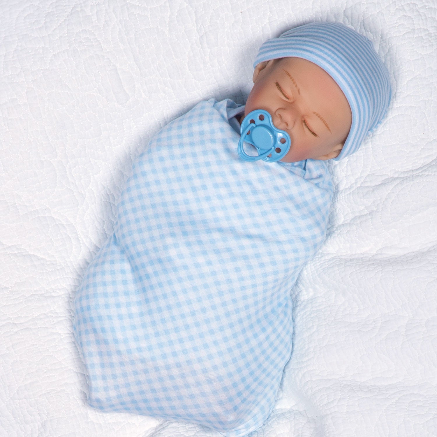 Swaddler Baby Checked Out - 18" Realistic Boy Doll by Reborn Artist, Michelle Fagan. Made in our exclusive SoftTouch Vinyl for an ultra-realistic feel!