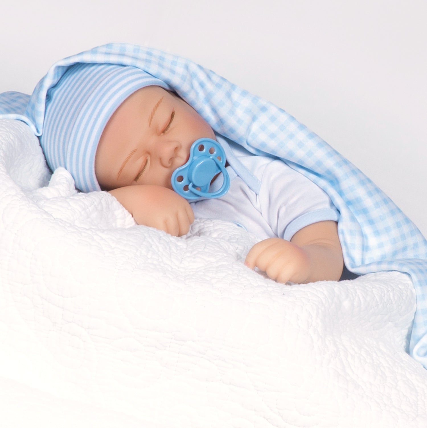 Swaddler Baby Checked Out - 18" Realistic Boy Doll by Reborn Artist, Michelle Fagan. Made in our exclusive SoftTouch Vinyl for an ultra-realistic feel!