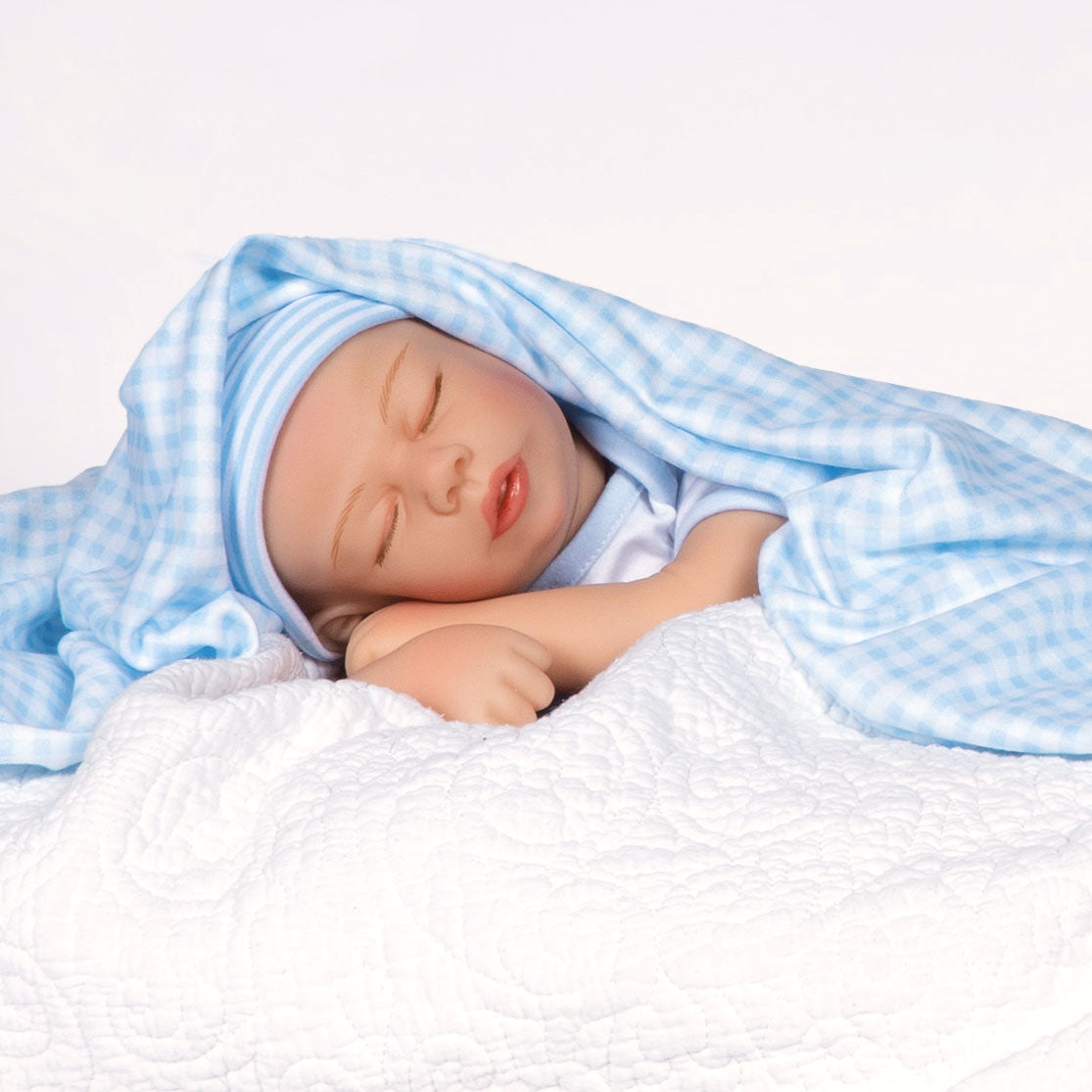 Swaddler Baby Checked Out - 18" Realistic Boy Doll by Reborn Artist, Michelle Fagan. Made in our exclusive SoftTouch Vinyl for an ultra-realistic feel!