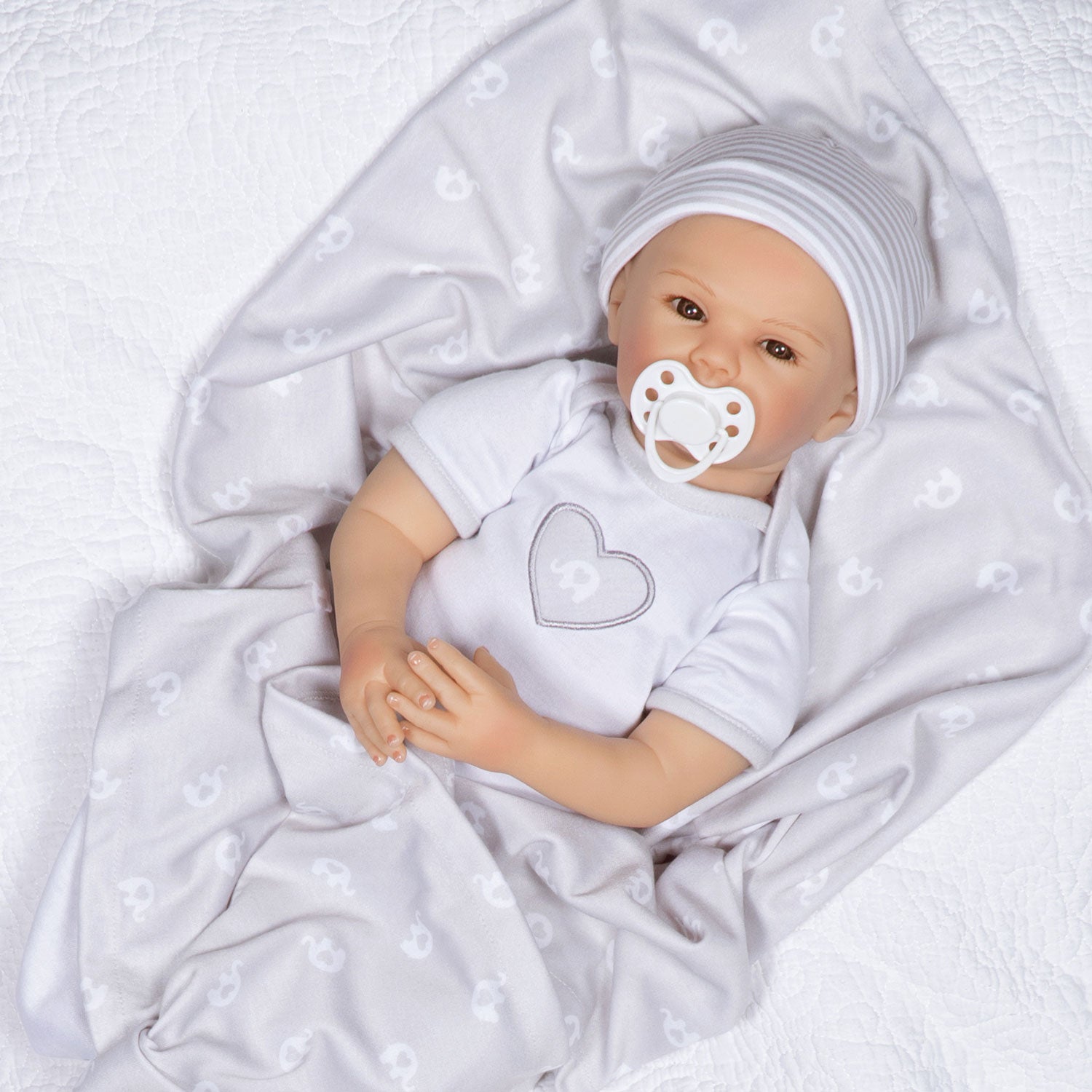 Swaddler Baby Little Elephant - 18" Realistic Doll by Reborn Artist, Michelle Fagan. Made in our exclusive SoftTouch Vinyl for an ultra-realistic feel!