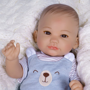 17" Realistic gender neutral newborn doll in Paradise Galleries exclusive GentleTouch Vinyl. Sculpted by award-winning artist, Ping Lau. 