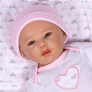 Swaddler Baby Bow Cute - 18" Realistic Girl Doll by Reborn Artist, Michelle Fagan. Made in our exclusive SoftTouch Vinyl for an ultra-realistic feel!